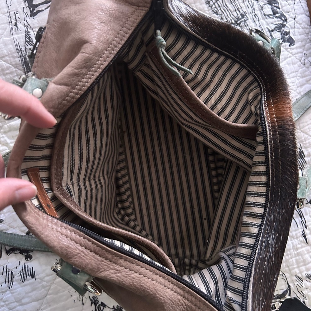 Holy Cow Couture town square. Well loved and still a beautiful bag.